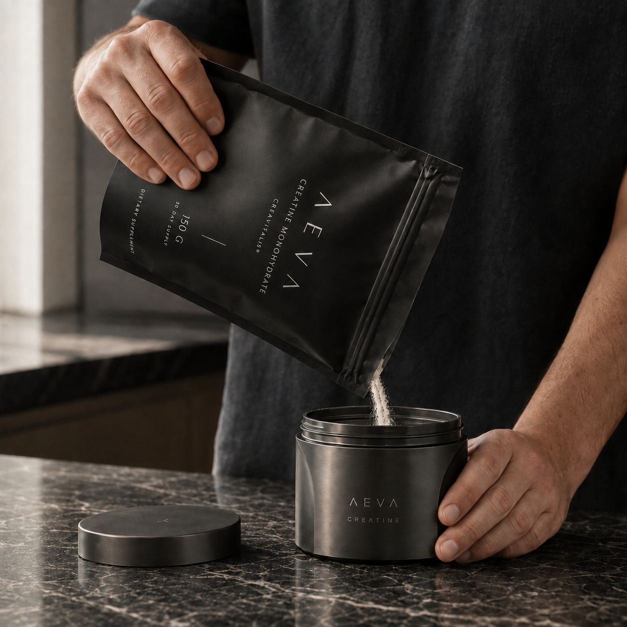 Pouring an AEVA refill into the reusable jar